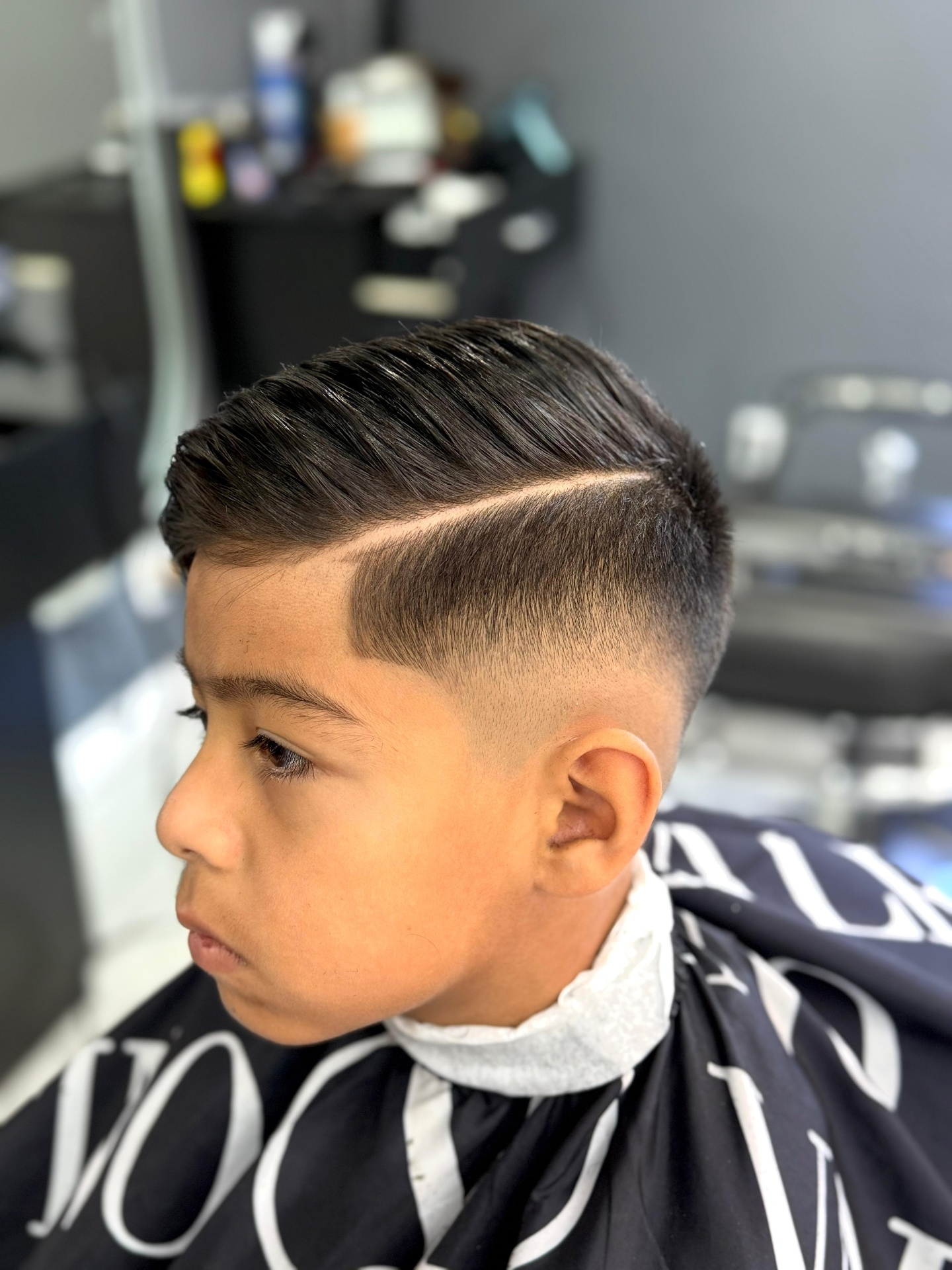 Kids side part with mid skin fade
