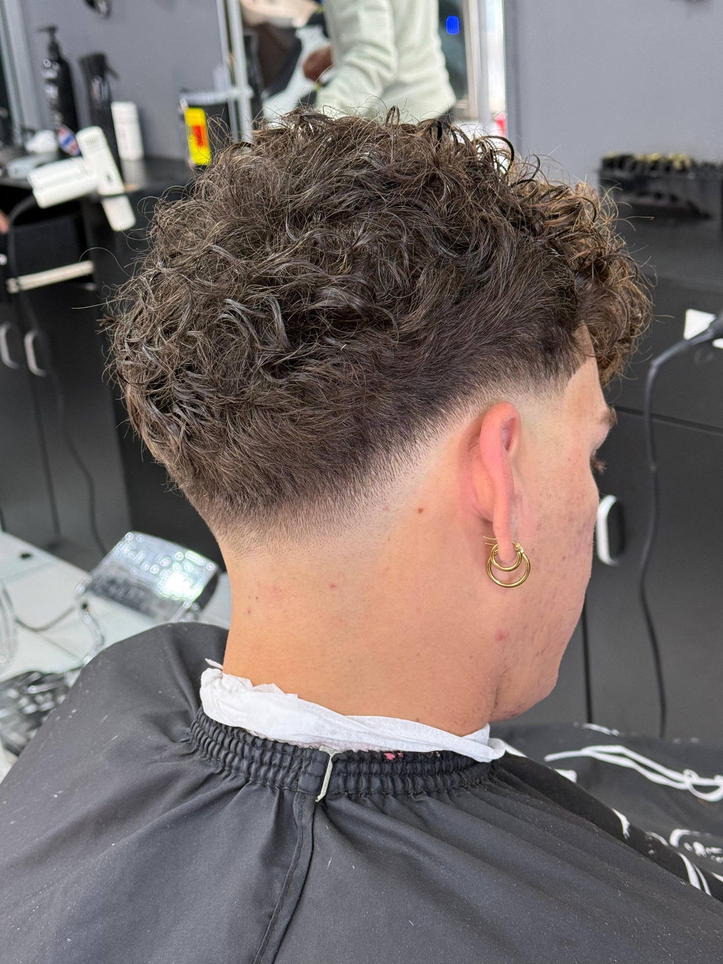 Curly top with low taper fade