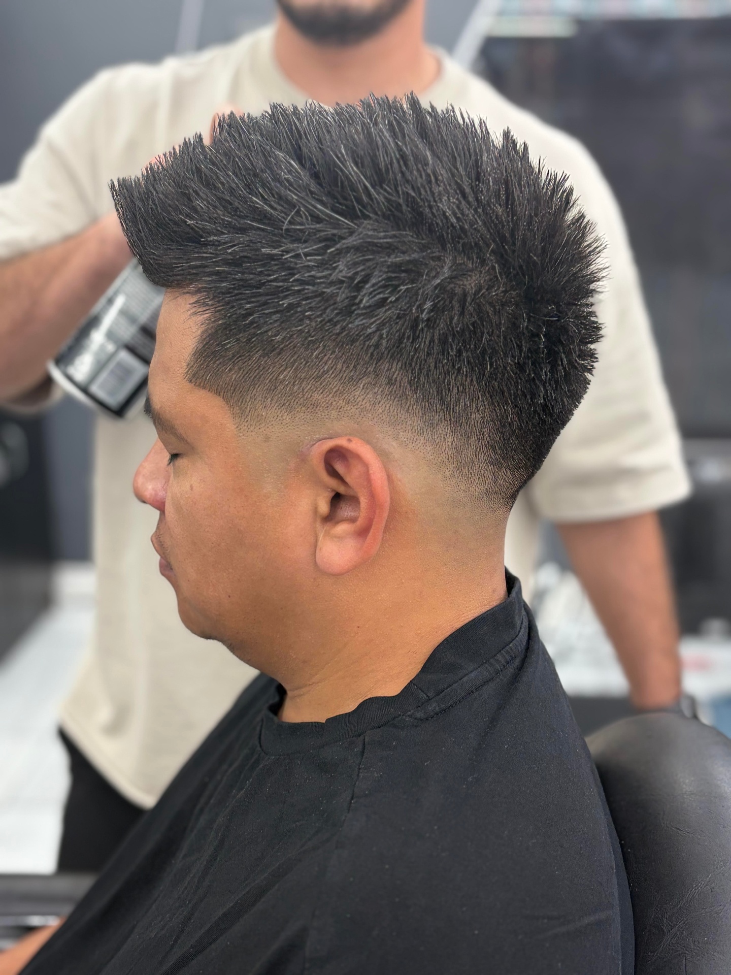Spiky top with mid skin fade