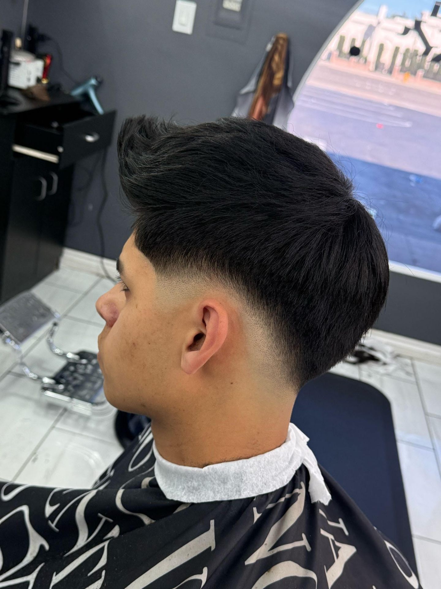 Textured pompadour with low fade