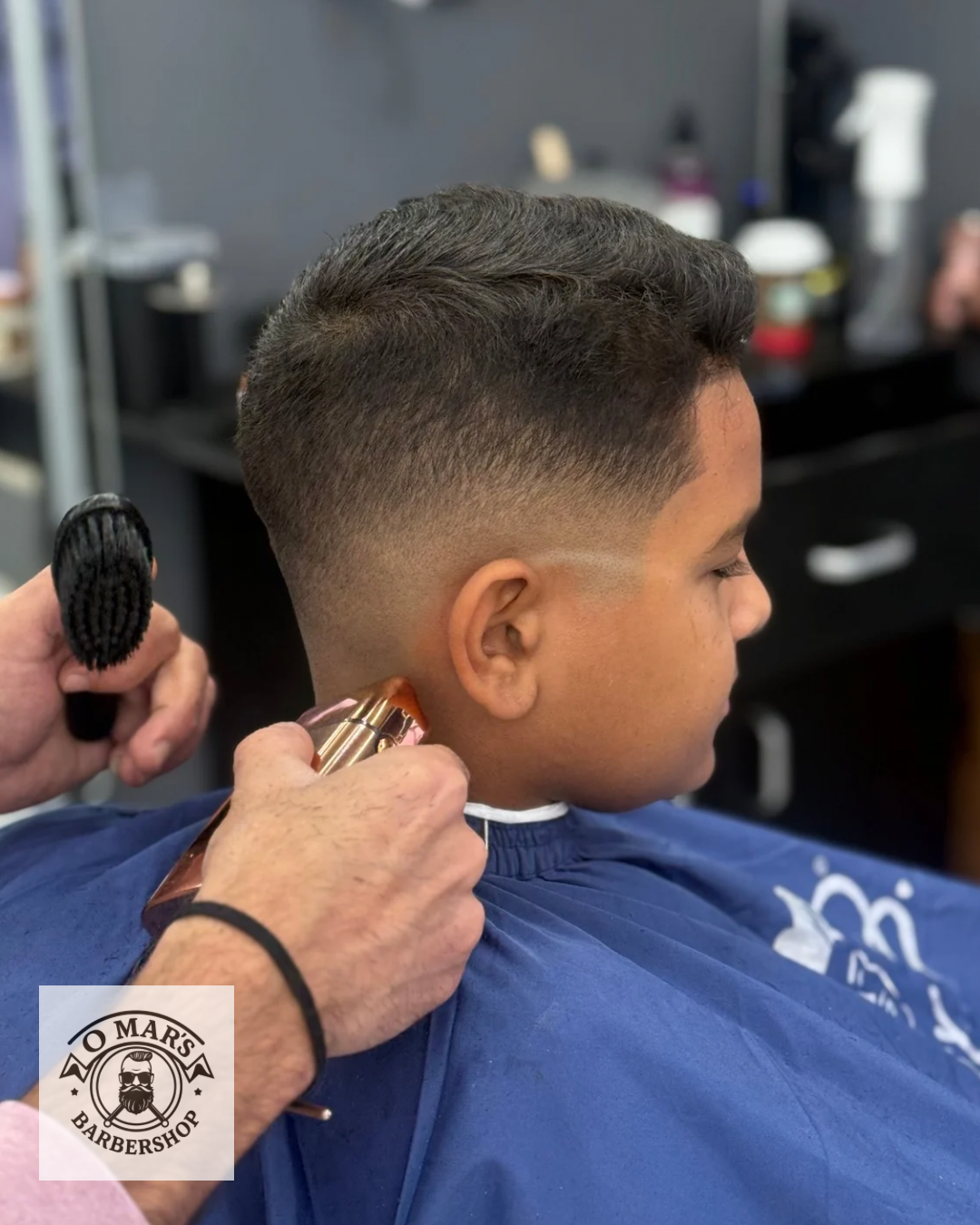Curly textured top with mid fade